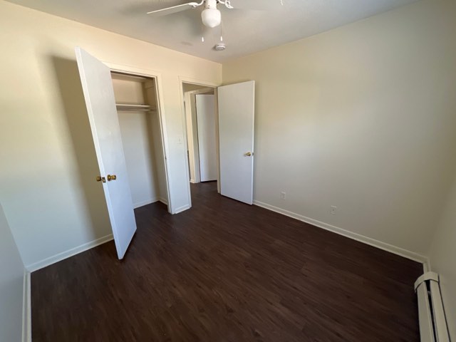 Bedroom with plank flooring