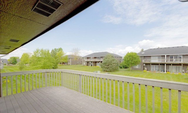 Private deck overlooking green space
