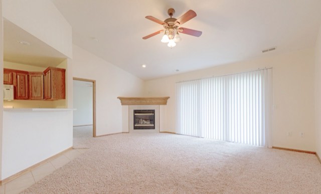 Living room with vaulted ceiling and gas fireplace